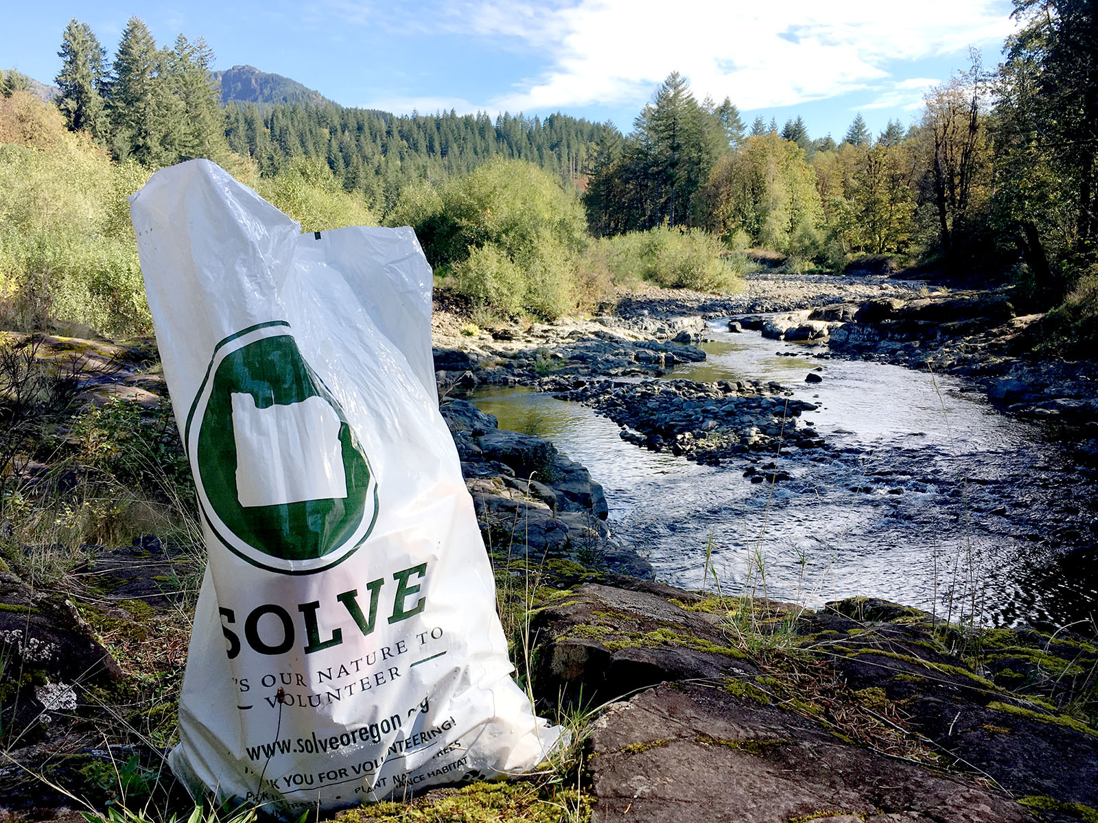 SOLVE bag in front of river 6WYbAC.tmp